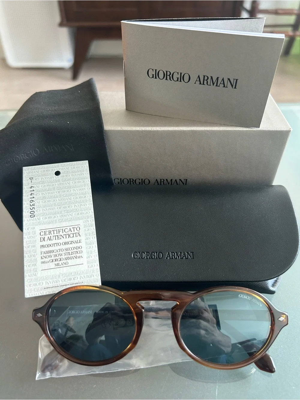 Giorgio Armani punched logo presentation